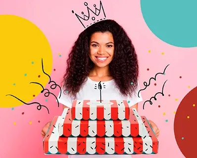 Woman celebrating birthday with Sugarwish gifts