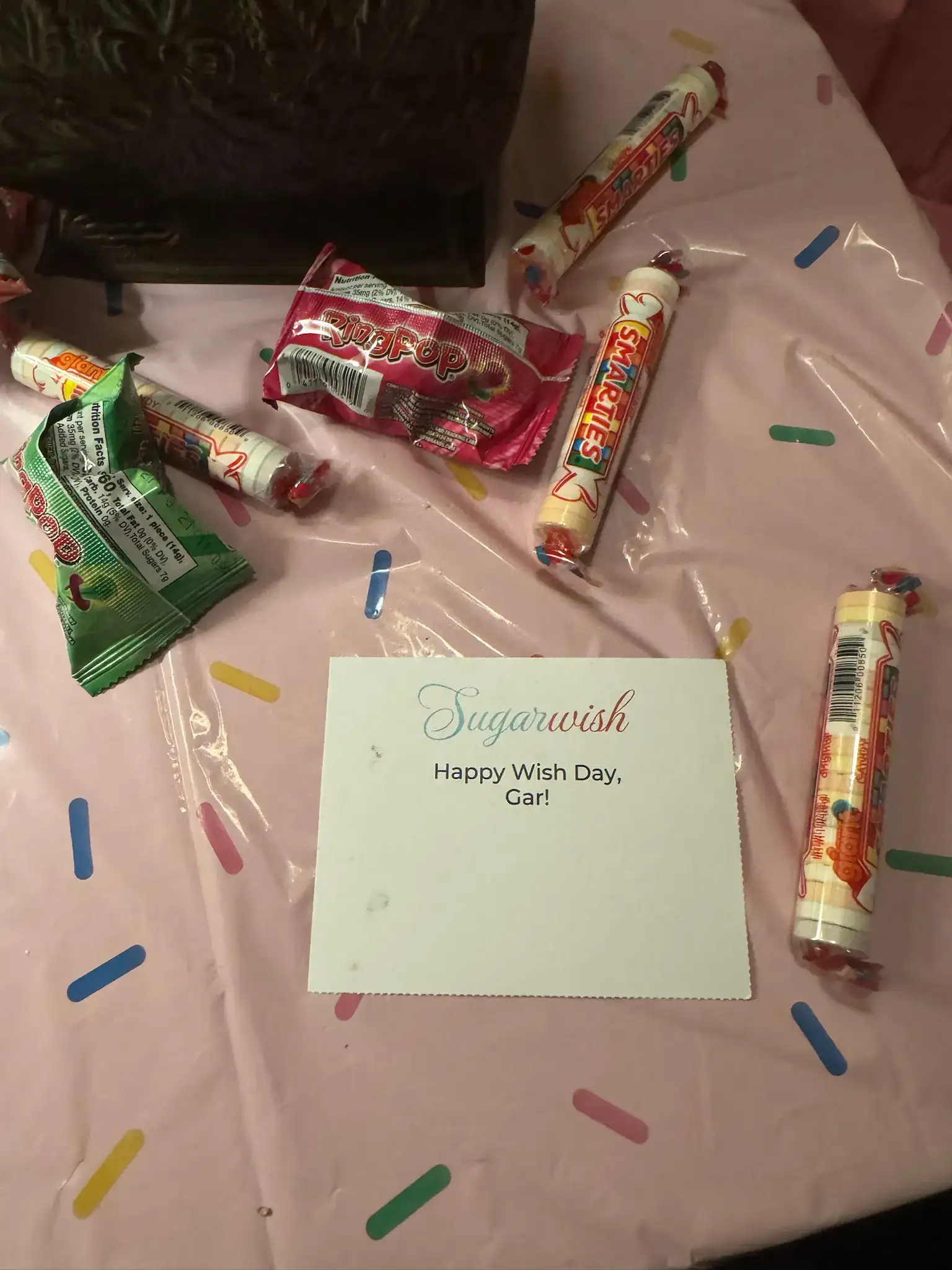 Sugarwish card reading 'Happy Wish Day, Gar!' surrounded by Sugarwish candies