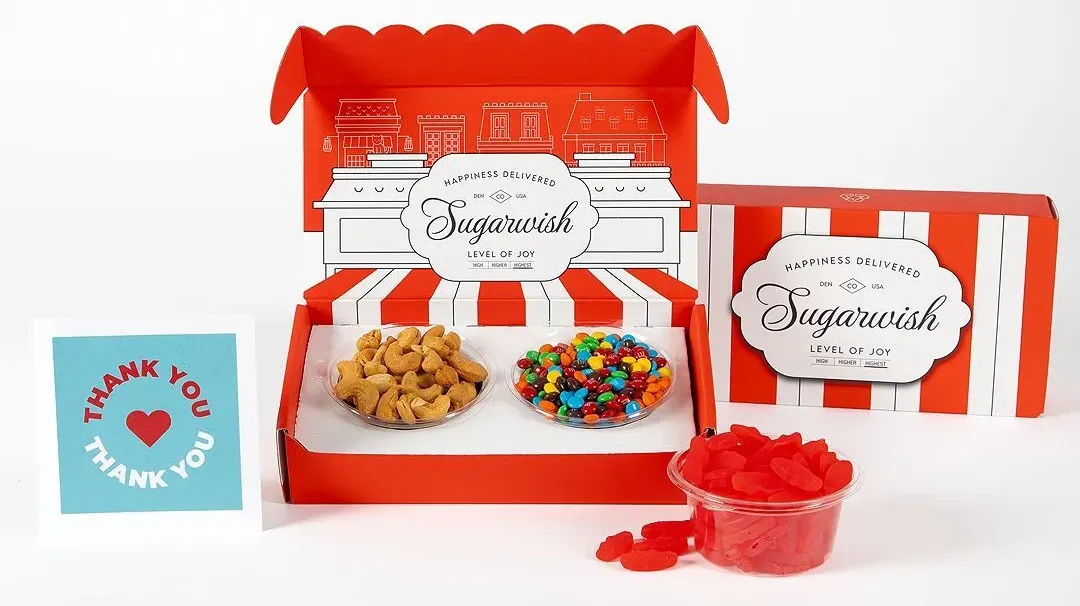 Sugarwish candy gift spread laid out on a table as a celebration centerpiece