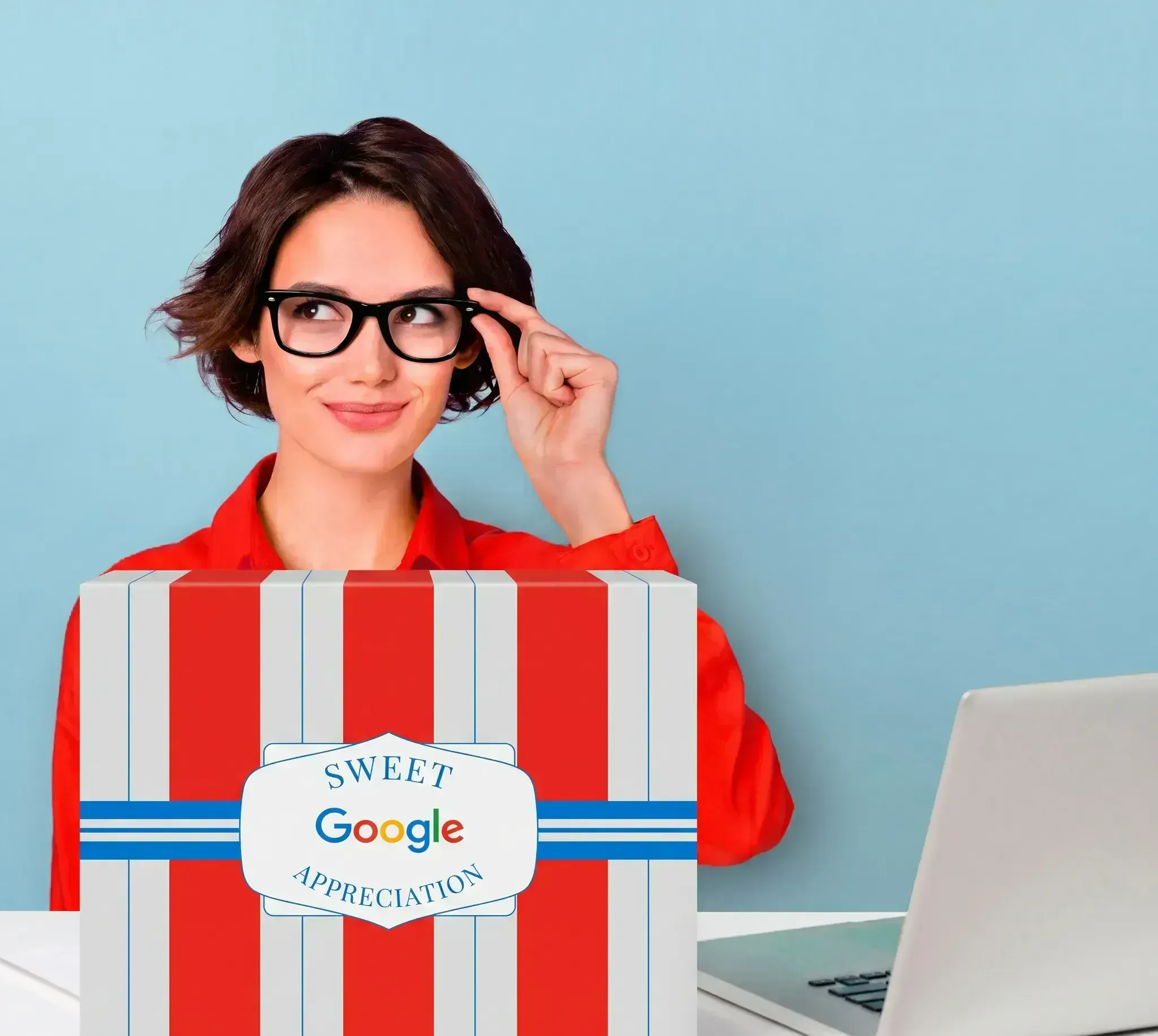 Woman at a desk holding a large custom branded Sugarwish gift box