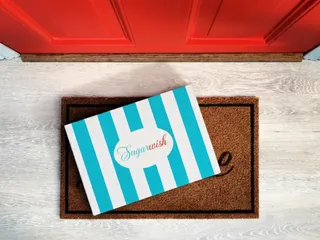 Sugarwish signature awning gift box being delivered