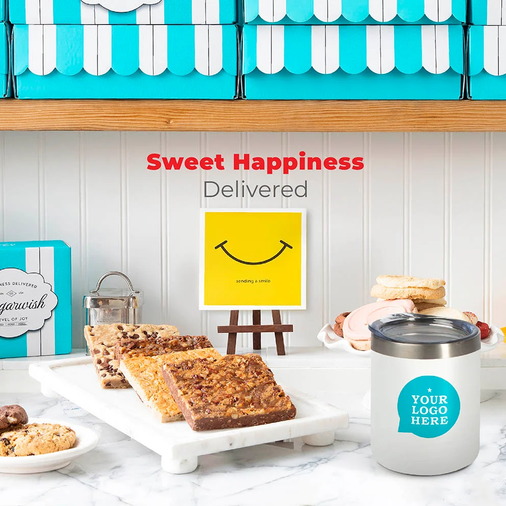 Person holding stacked branded Sugarwish gift boxes