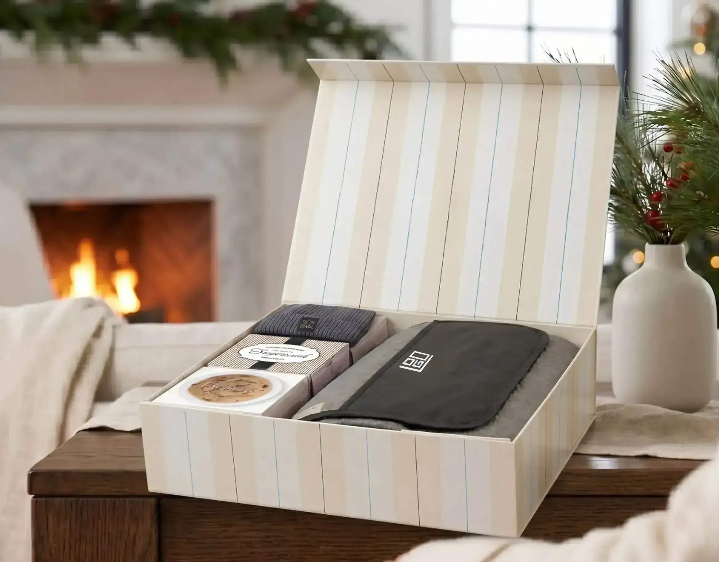 Open Holiday Reserve keepsake box showing impact gift, Sugarwish treats, and surprise items