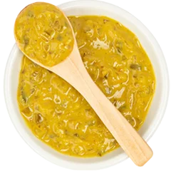 image of yellow mustard with a spoon spreader