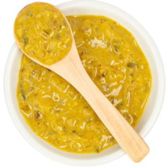 image of yellow mustard with a spoon spreader