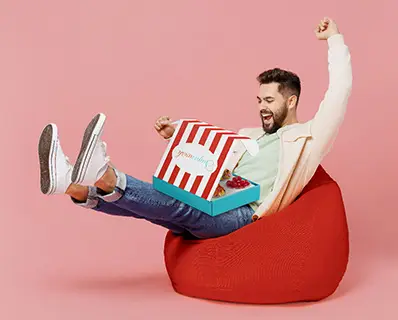 A boy buying and recieving sugarwish holiday Candy gifts.